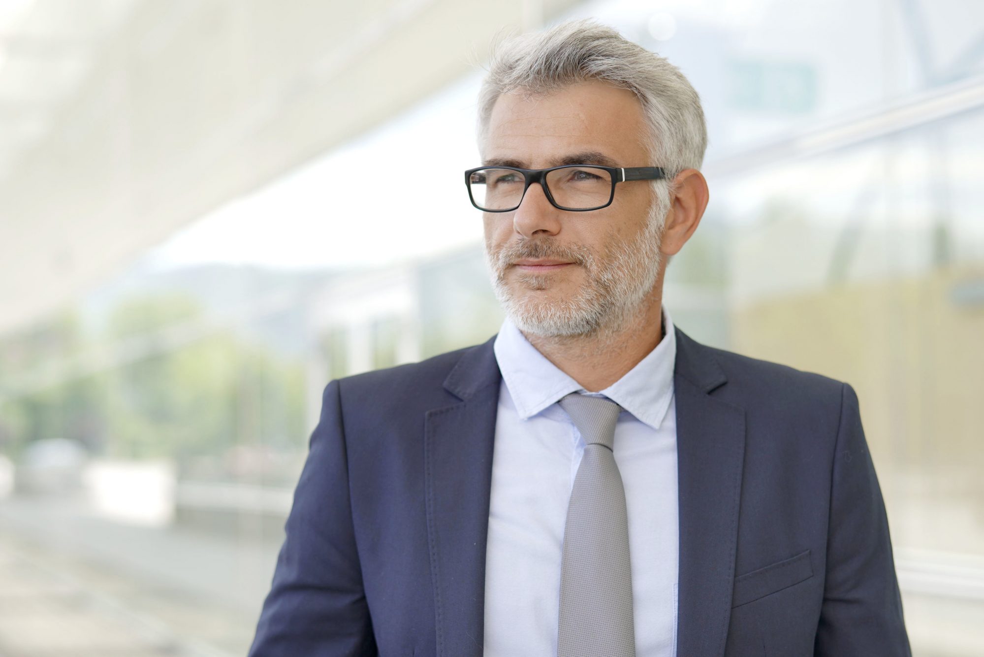 Portrait Of Corporate Businessman Outside Contemporary Office Building