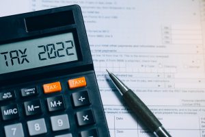Word Tax 2022 On The Calculator On Documents.income Statement. P